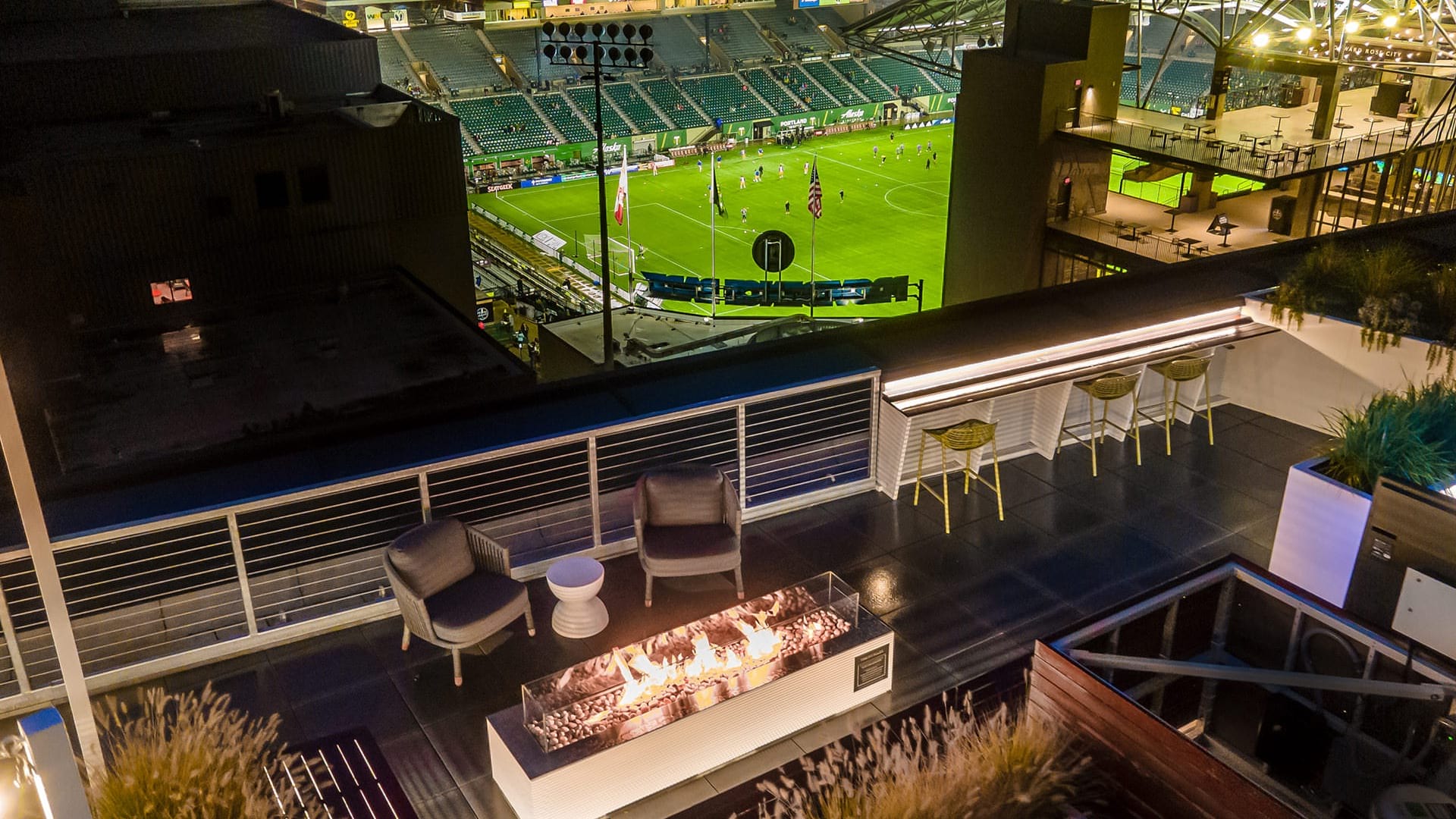 fireplace on rooftop deck overlooking soccer field